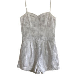 Guess white eyelet romper with adjustable straps and pockets. Size 2